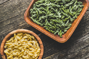 Uncooked spinach gemelli pasta.