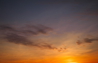 Beautiful bright colorful sky. Picture taken at sunset. Red-orange background with nice paints. Rare sunrise. Natural composition