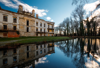 old castle pottendorf, reflection of the old building in a lake in autumn