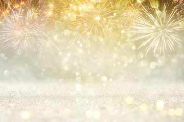 abstract gold glitter background with fireworks. christmas eve, new year and 4th of july holiday concept.