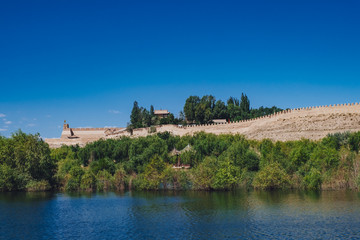Ming dynasty great wall of China and architecture over water at Jiayu Pass, Jiayuguan, China