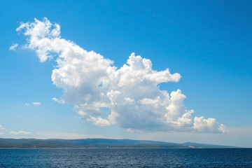 blue sky and a big white cloud, seascape background
