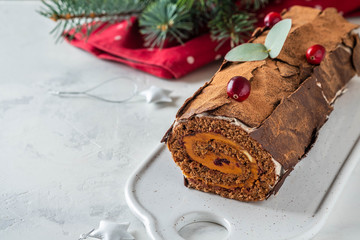 Bush de Noel Christmas Log Cake and New Year background. Copy space.
