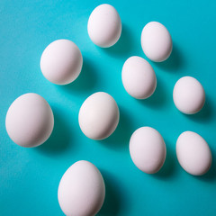 eggs pattern over blue pastel background. Flat lay.