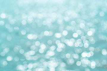 Blur beach with bokeh blue color background.