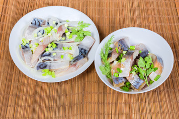 Sliced smoked and salted Atlantic mackerel in different dishes