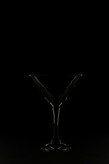 Glass silhouette on black background.