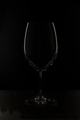 Glass silhouette on black background.