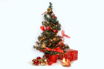symbol of the new year at the Christmas tree with toys