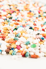 High number of pills on white background surface. High resolution image for pharmaceutical industry.