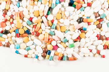 High number of pills on white background surface. High resolution image for pharmaceutical industry.