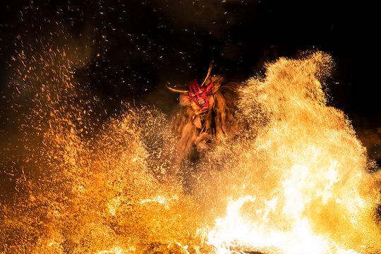 The Krampus masks in an exhibition in the night in Tarvisio, Italy