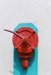 Red ancient fire extinguisher with white background