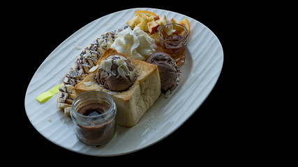 Bread with ice cream on black background