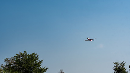 The aircraft is flying at a distance.