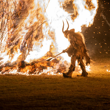 The Krampus masks in an exhibition in the night in Tarvisio, Italy