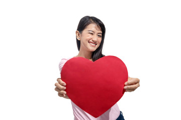 Portrait of asian woman holding red paper heart