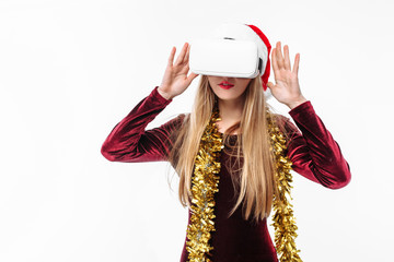 Portrait of a young girl in a Santa Claus hat with glasses, 3D glasses.