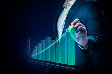 Businessman drawing a increases graph on virtual screen