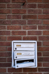 mailbox on brick wall
