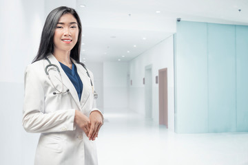 Young asian woman doctor with lab coat and stethoscope
