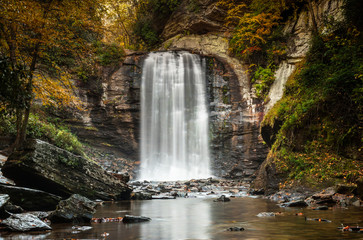 Looking Glass falls in the Appalachians of North Carolina in late autumn with fall color foliage