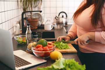 woman preparing food on weight management.