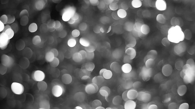Black and white abstract bokeh Christmas holiday background. Real time full hd video footage.