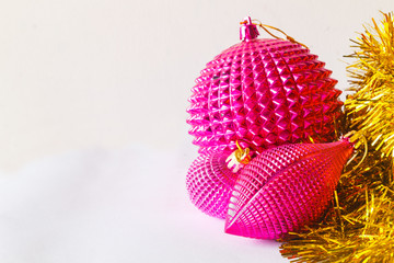 pink christmas toys balls with new year gold tinsel