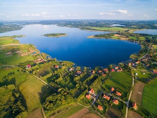 Aerial view of beautiful Kal village (former Kehlen or Kielno, East Prussia) located on Swiecajty Lake shore, Mazury, Poland