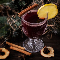 Mulled wine with spices and fruits. Closeup