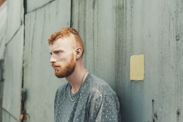 urban man posing at grunge backgrounds