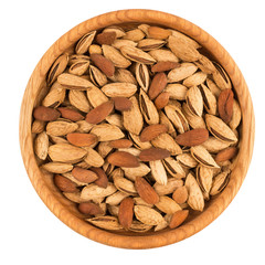 Almond nuts with shell in a wood bowl Isolated on white background.