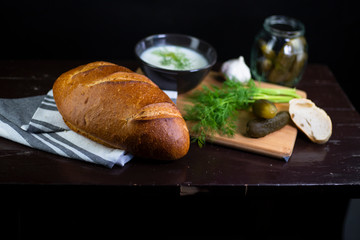Fresh bread with lard and pickled cucumbers