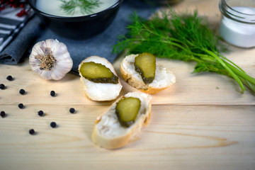 Fresh bread with lard and pickled cucumbers