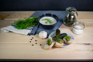Fresh bread with lard and pickled cucumbers