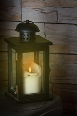 Christmas decoration lantern with burning candle