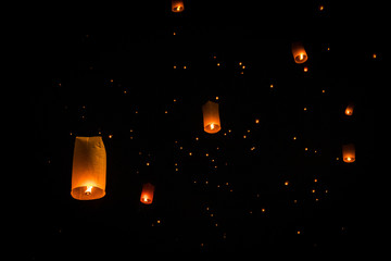 Sky lanterns during Yi Peng festival in Chiang Mai, Thailand © Yann