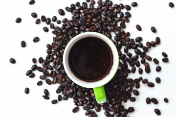 cup of coffee with beans on white background