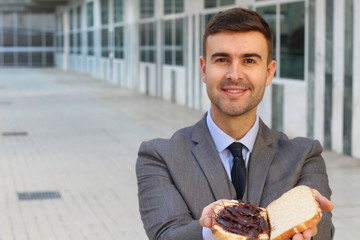 Businessman eating a high protein cockroach sandwich