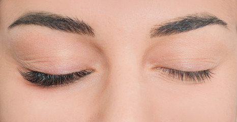 Photo comparison of normal and fake cosmeticly enlarged lashes. 