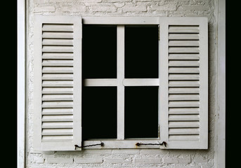 White colored wooden window on white painted brick wall 