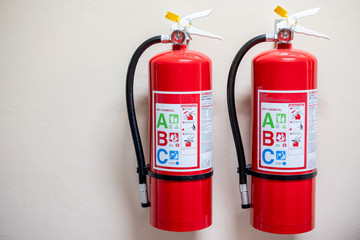 Fire extinguisher system on the wall background, powerful emergency equipment for industrial