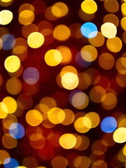 Yellow and blue light dots on the red background