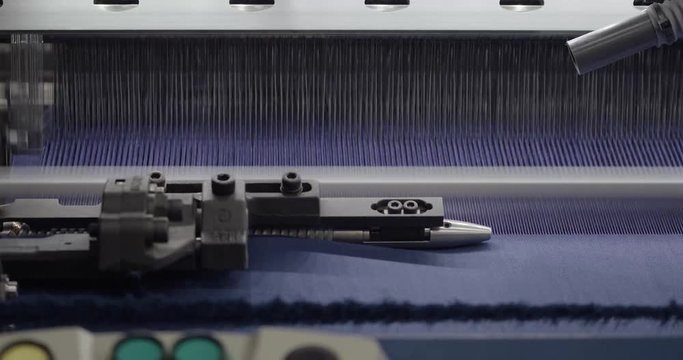 Spinning factory, production of fabrics, thread of silk, linen, and synthetics, spinning machine at work on light industry.