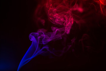 Colorful smoke close-up on a black background