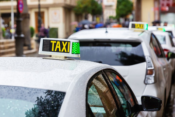 taxis standing in a row in Seville, Spain