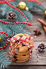 Chocolate cookies and christmas decoration on grey wooden background
