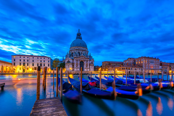Canal Grande with Venice gondola and Basilica di Santa Maria della Salute in Venice, Italy