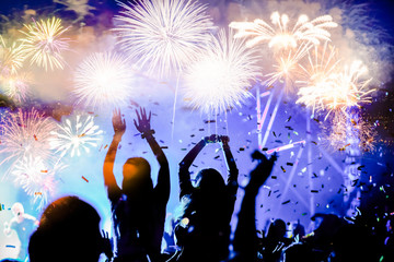 Fototapeta na wymiar crowd watching fireworks - New Year celebrations- abstract holiday background